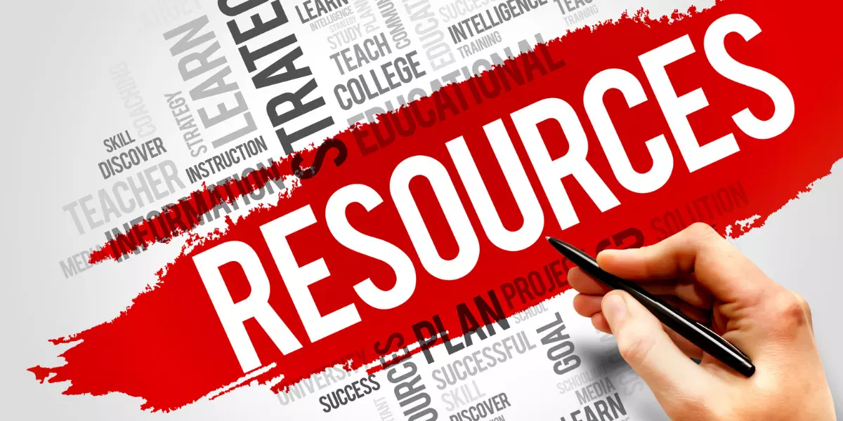 Red paint over white background with word cloud, resources, teach, learn